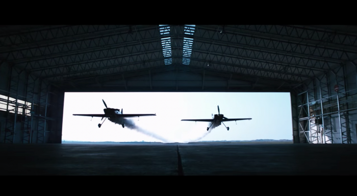 Watch Two Planes Fly Through a Hangar in Red Bull’s ‘Barnstorming’