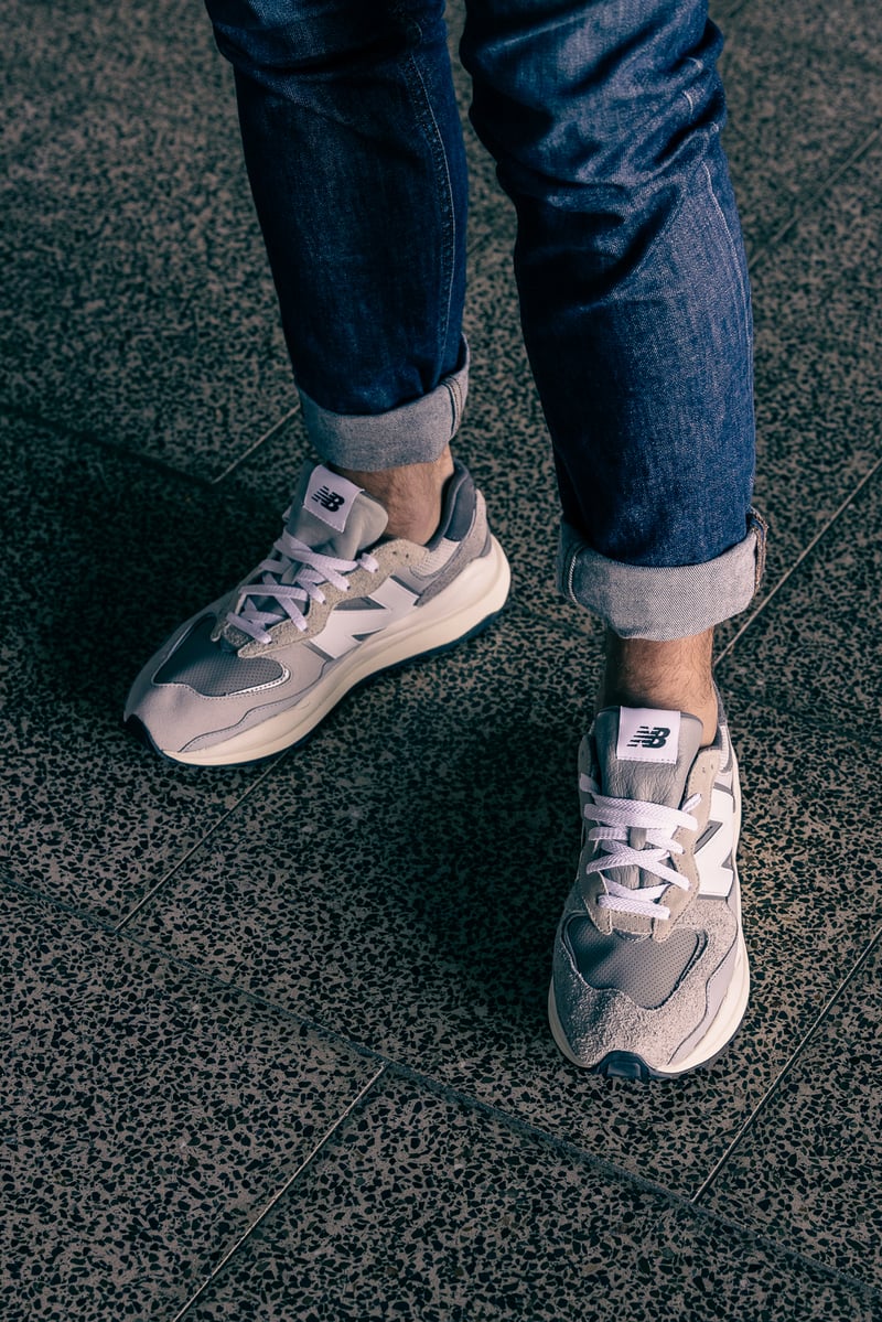 A close up of feet wearing blue shoes