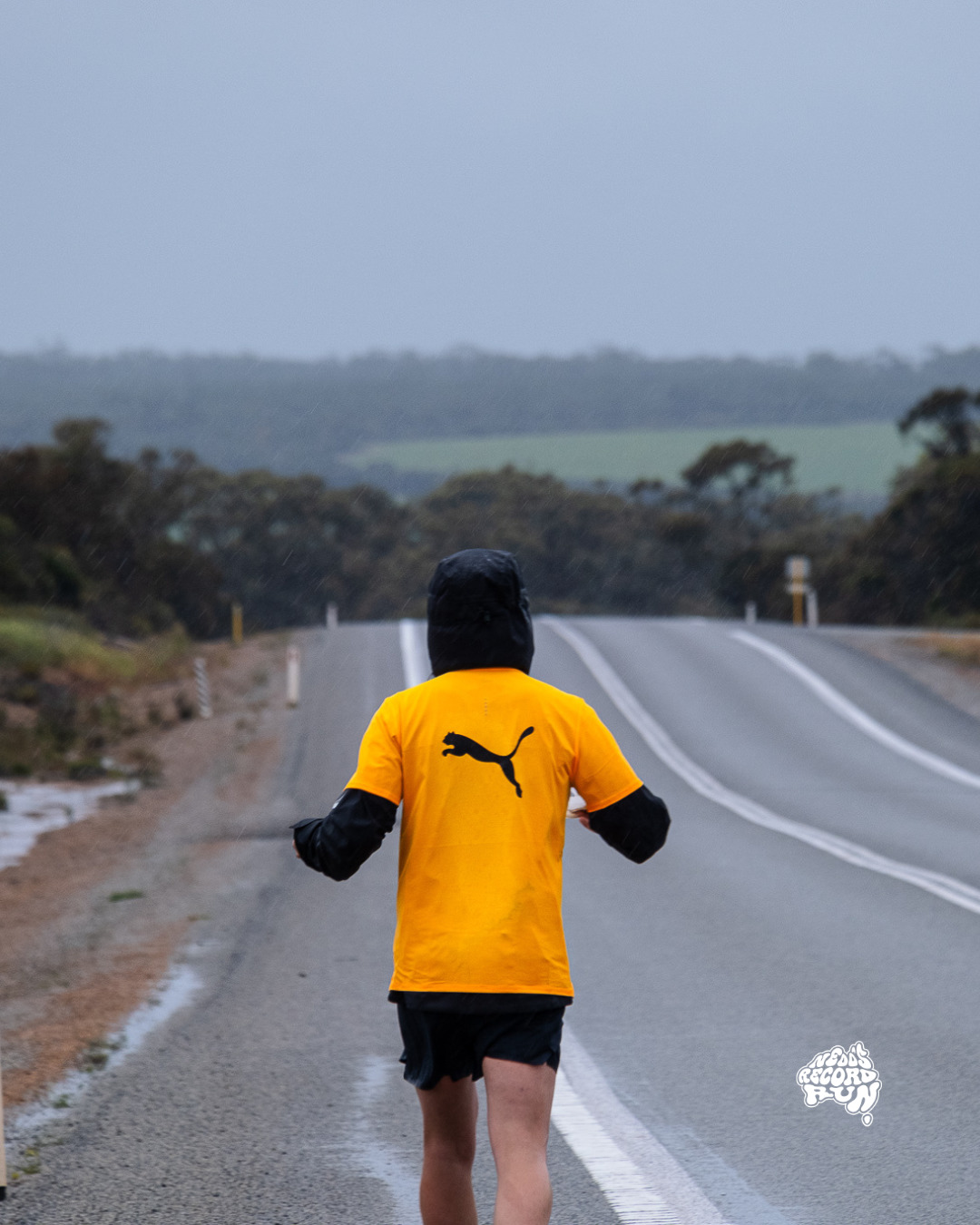 Nedd Brockmann running in the rain. 