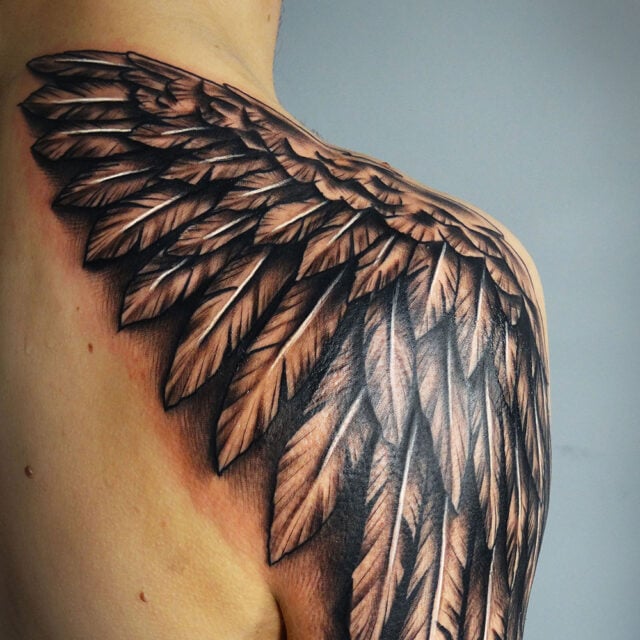 angel wings tattoo on shoulder blade