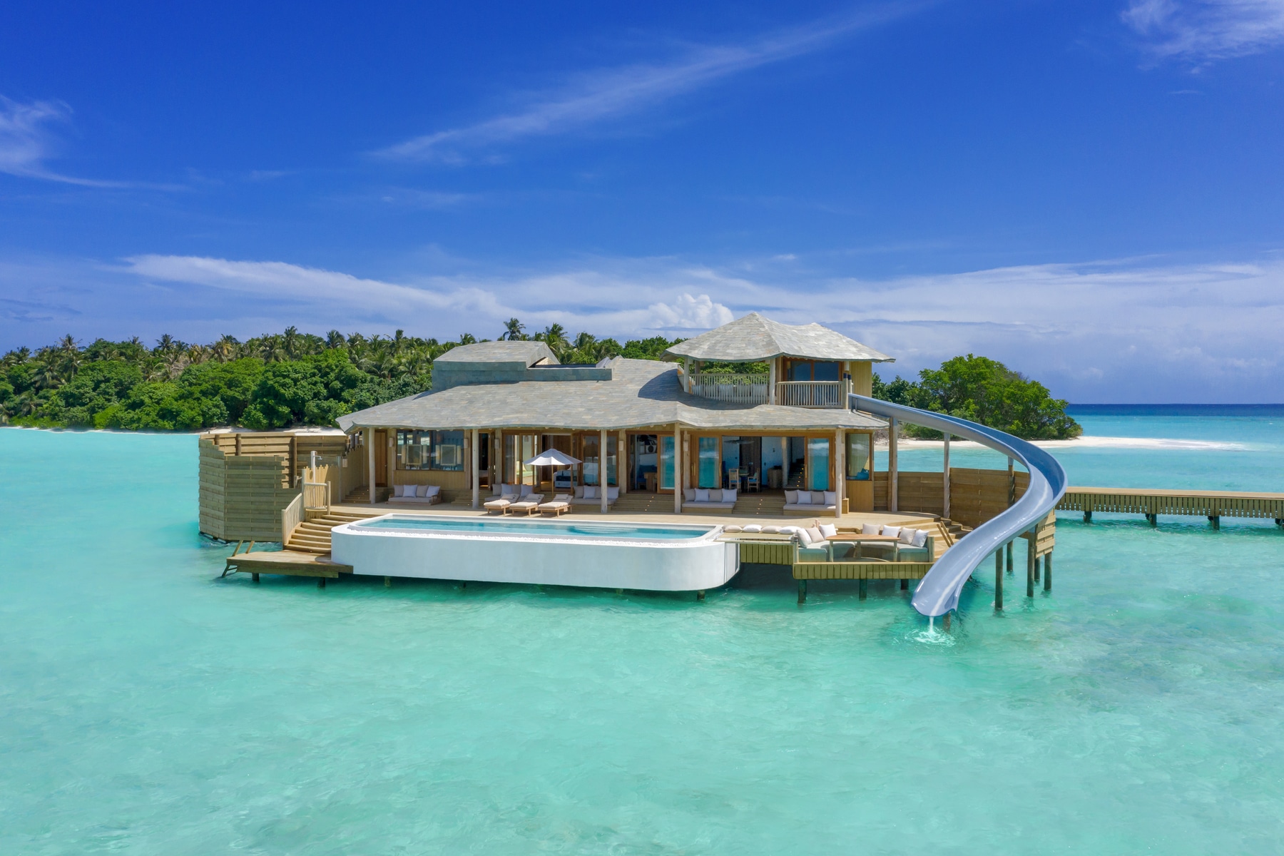 Soneva Fushi Resort Will Have Overwater Villas With A Built In Water Slide
