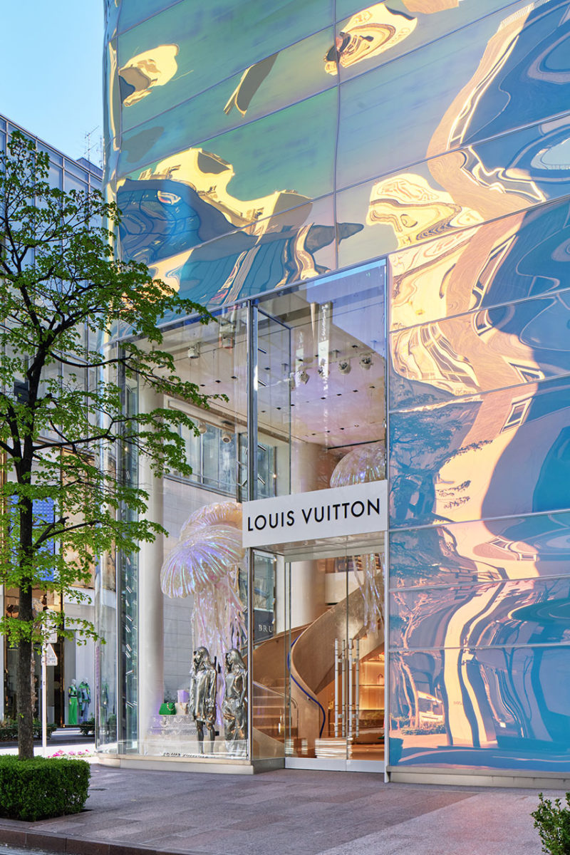 Louis Vuitton building surrounded by body of water photo – Free
