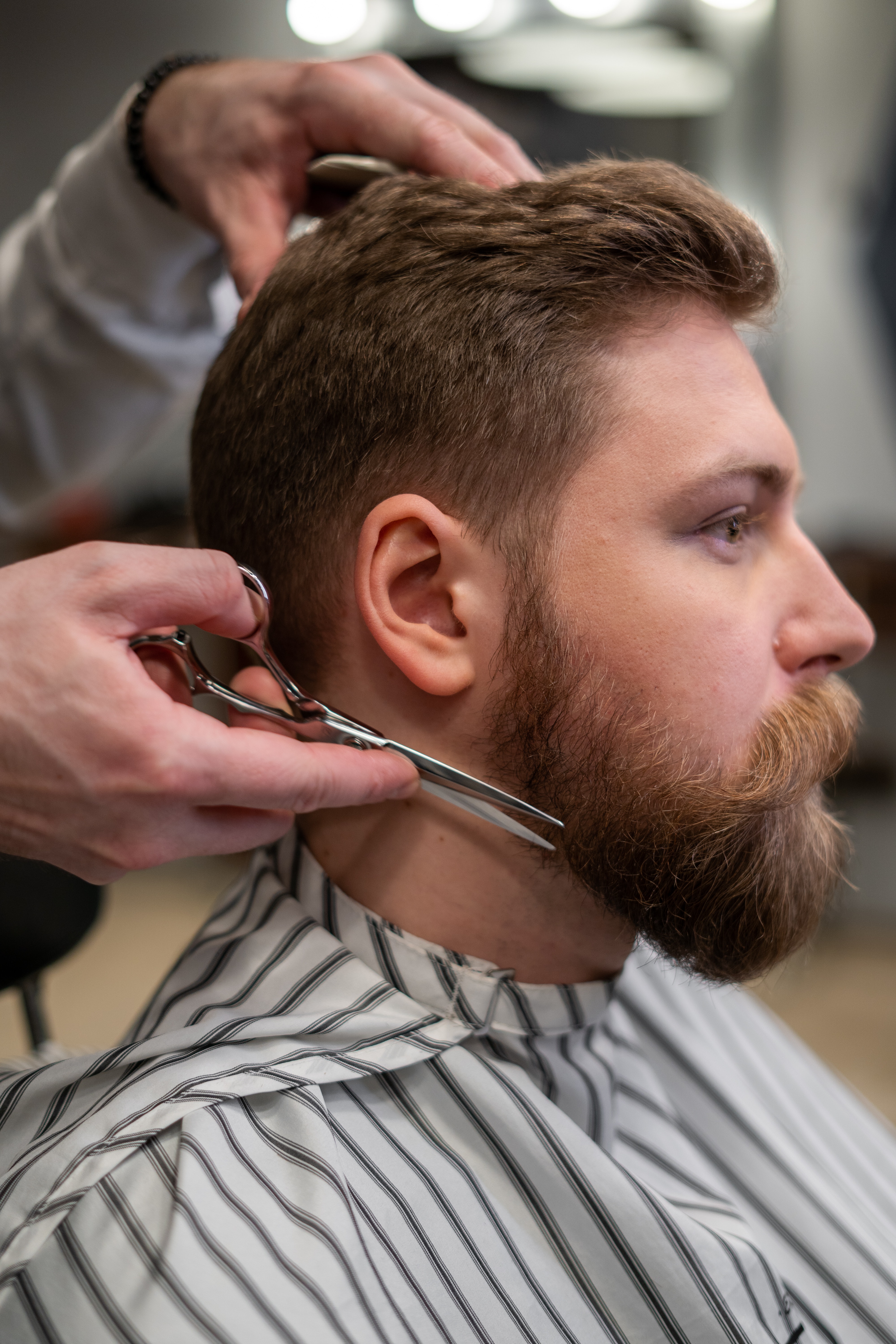 Confident man with a chiseled jawline and stylish haircut